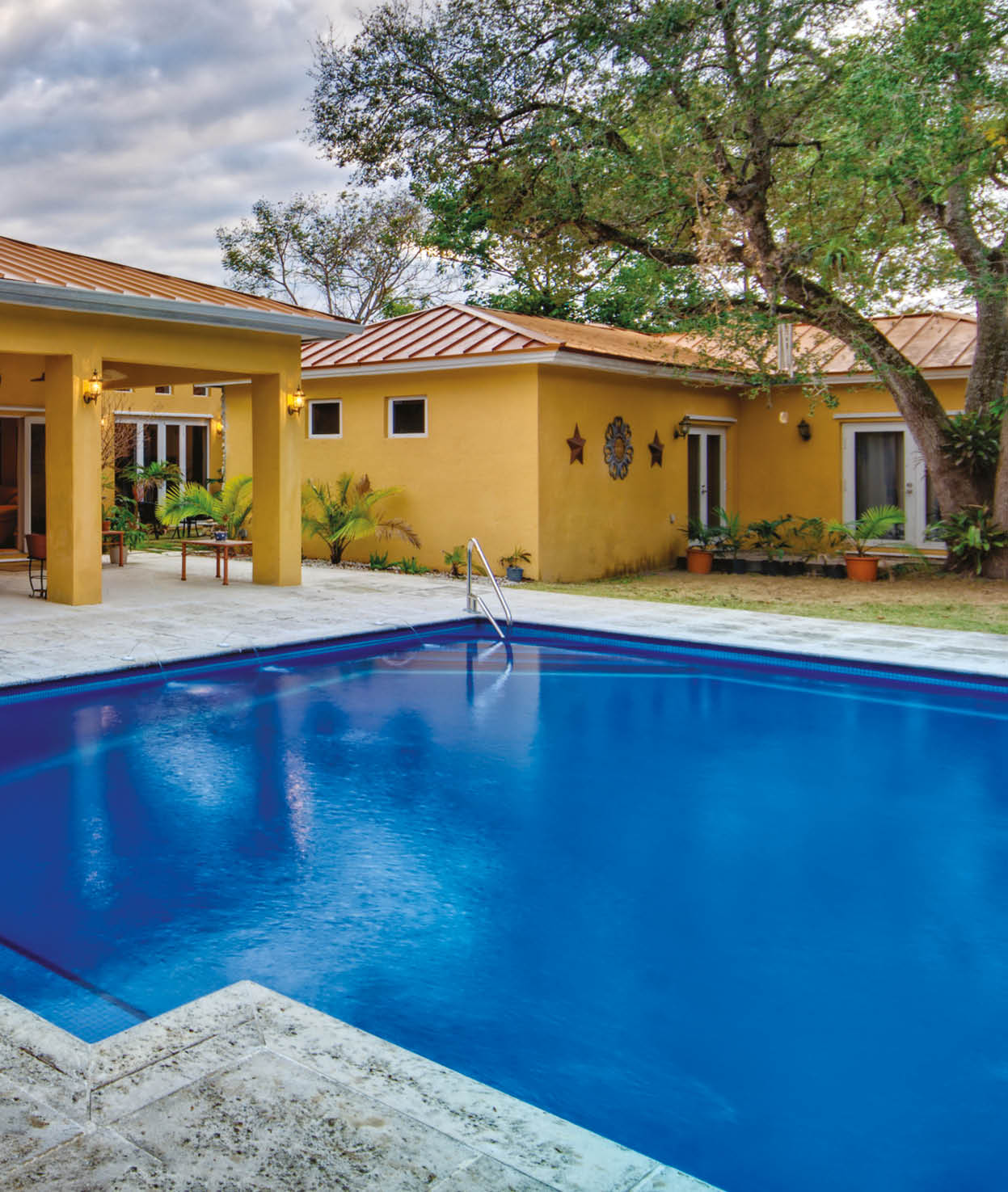 View of modern home backyard with swimming pool 