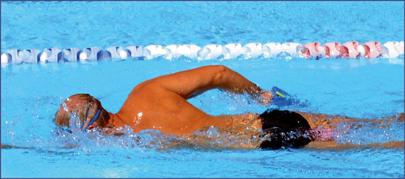 Unrecognized person swim in swimming pool. Background texture. concept photo water, sport, swimming.