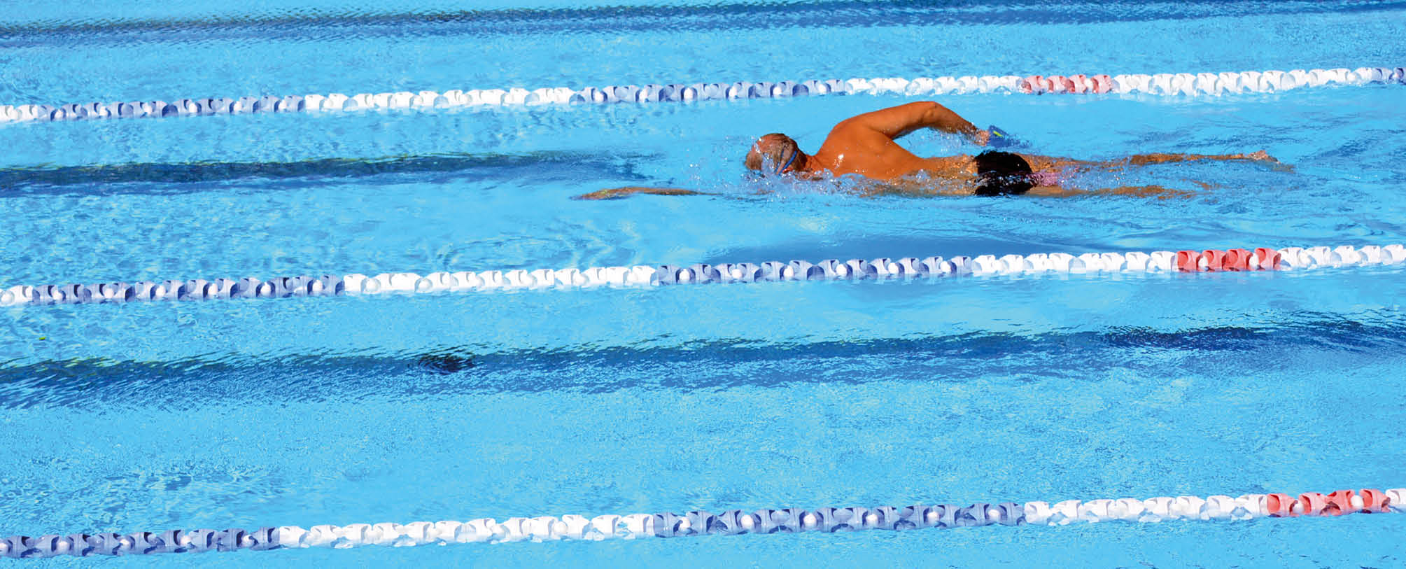 Unrecognized person swim in swimming pool. Background texture. concept photo water, sport, swimming.